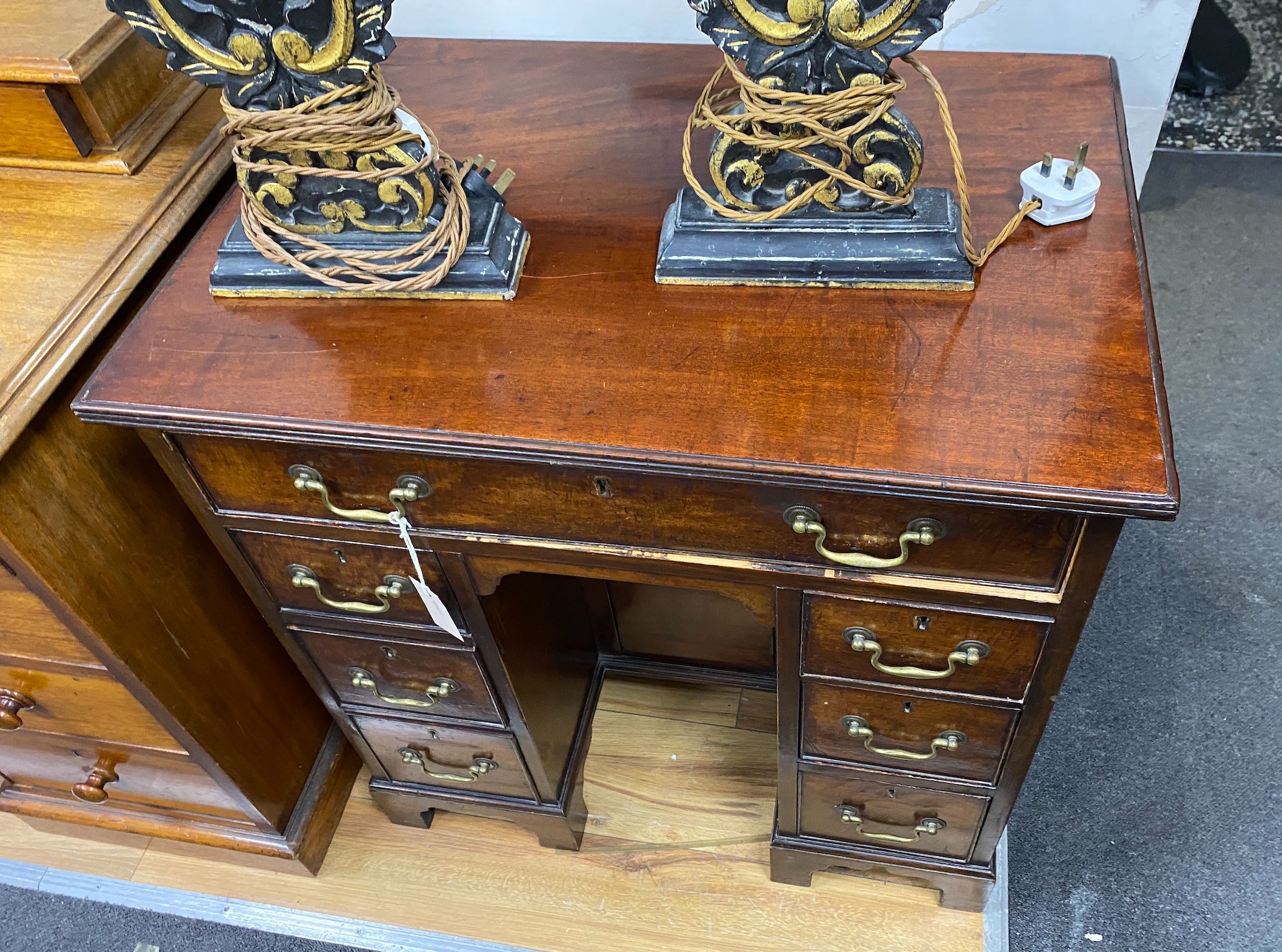 A George III style mahogany kneehole desk, width 73cm, depth 50cm, height 77cm